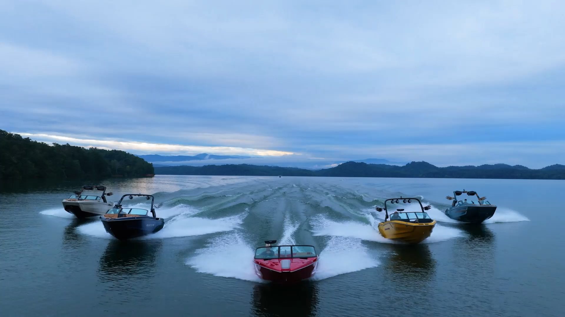 New and pre-owned boats running on the water at American Marine
