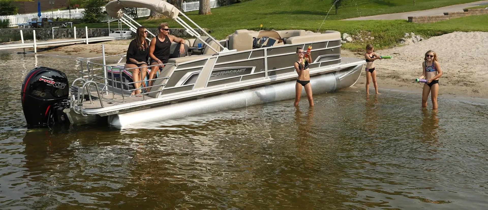 Pontoon boat rental cruising on Lake Winnipesaukee with mountain views