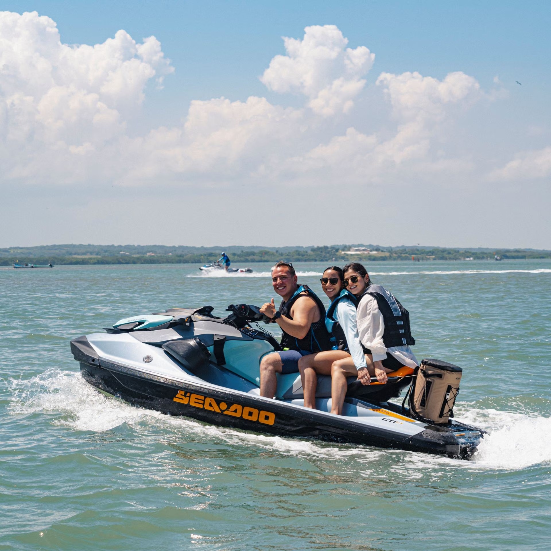 Riders on a Sea-Doo personal watercraft
