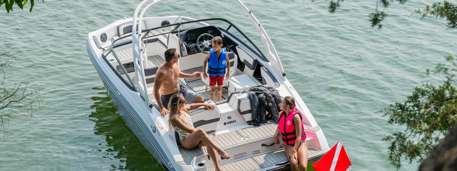 Family aboard a Yamaha boat serviced by Irwin Marine