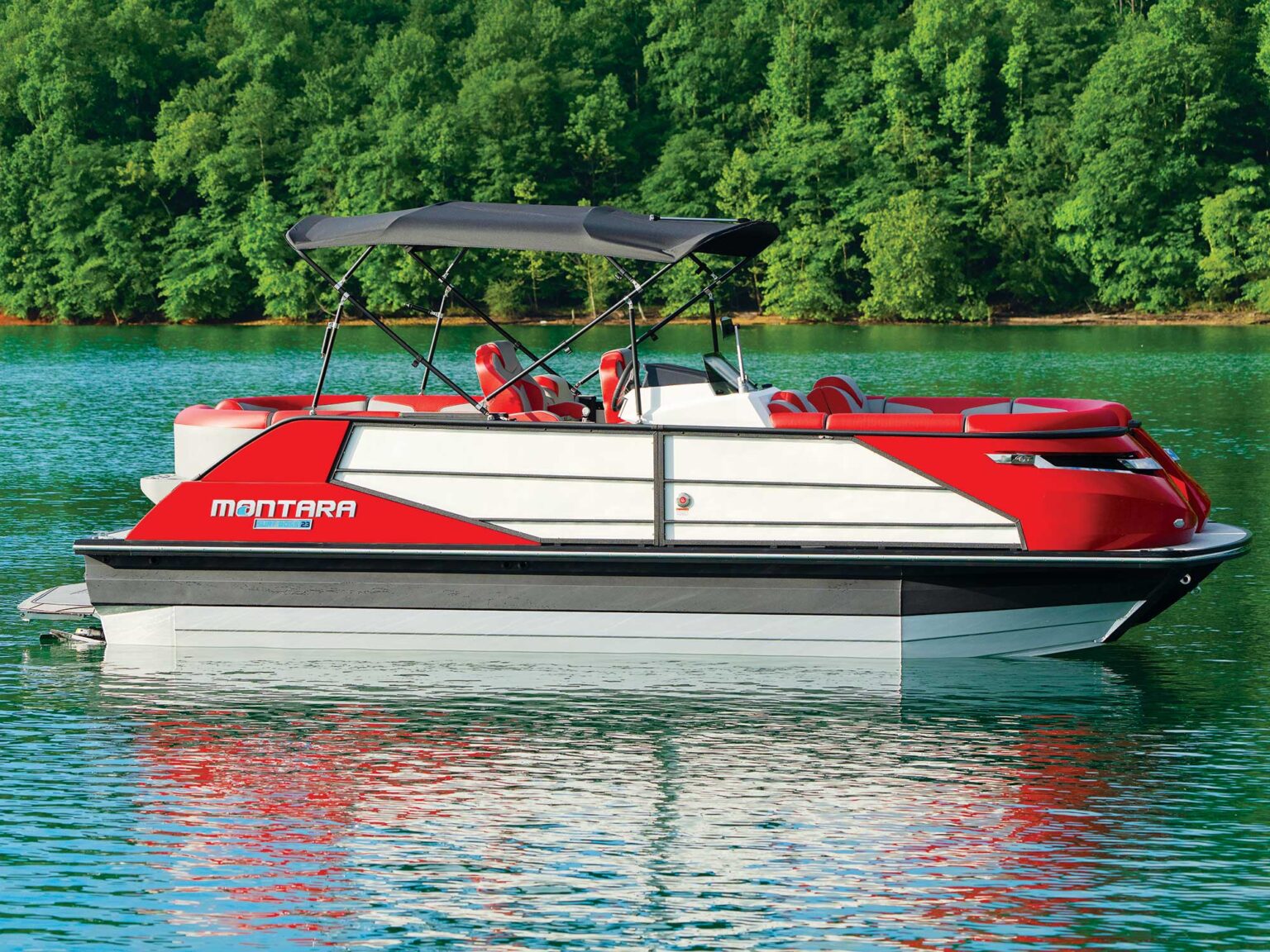 Our tester had a Bimini top that raised and lowered at the touch of a button on the dash. Courtesy Montara Boats