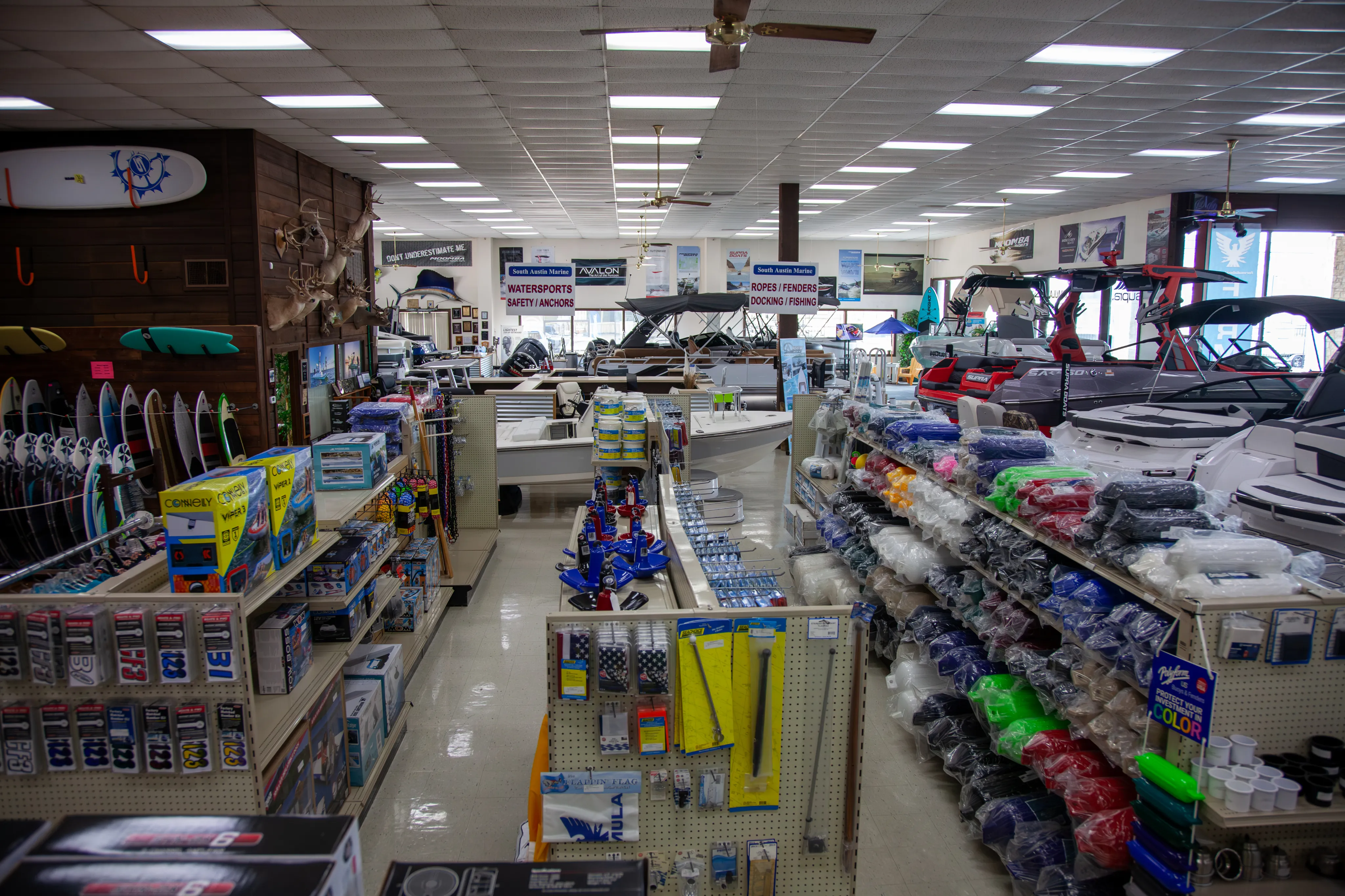 Knowledgeable parts department staff assisting customer with marine accessories selection