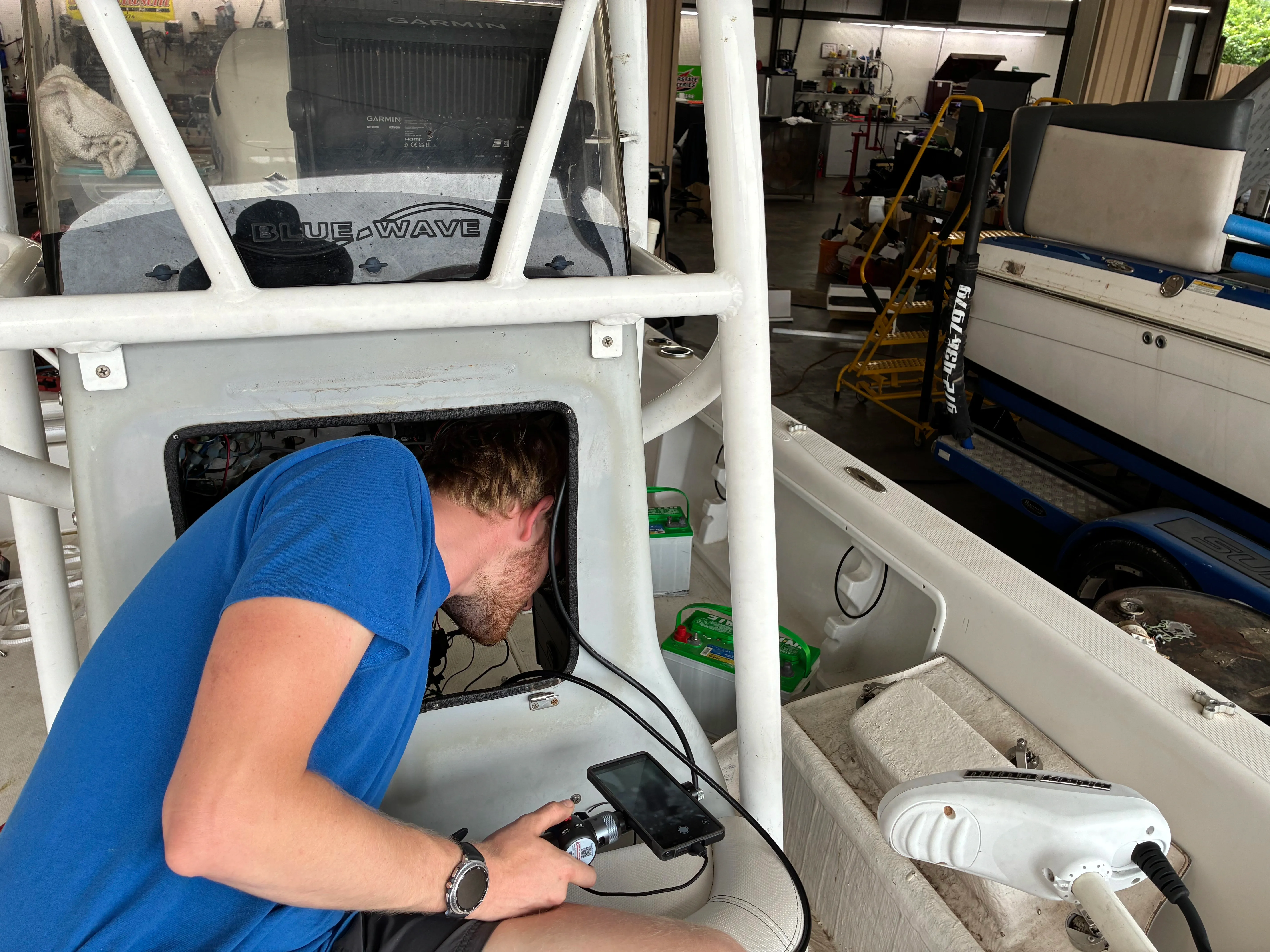 Professional consignment specialist reviewing boat details with seller at South Austin Marine