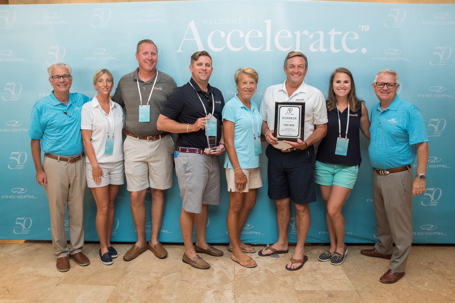 The Strong's Marine team receives their award for 9th Regal Dealer in the US!.