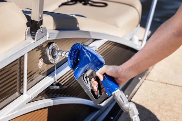 man-refueling-boat-marina
