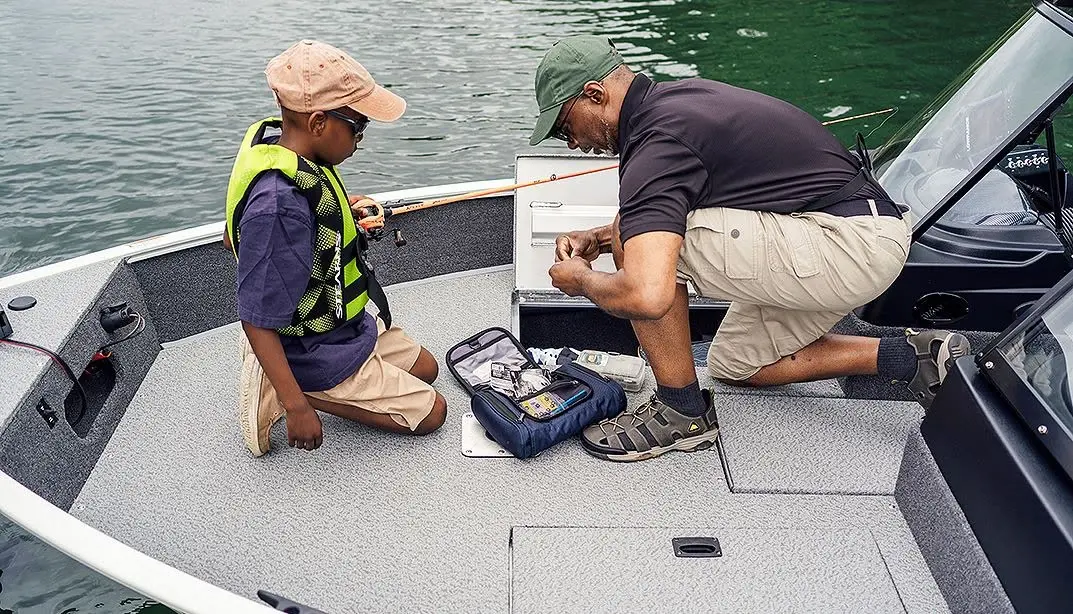 Causeway Marina staff preparing a rental boat