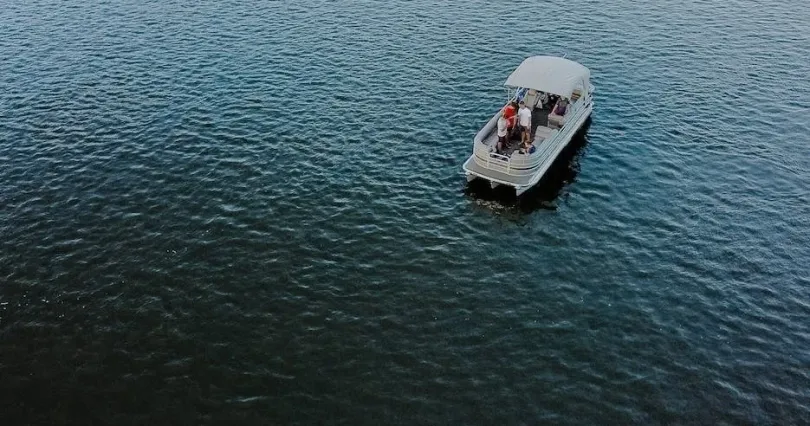 13 person tritoon rental boat on the lake