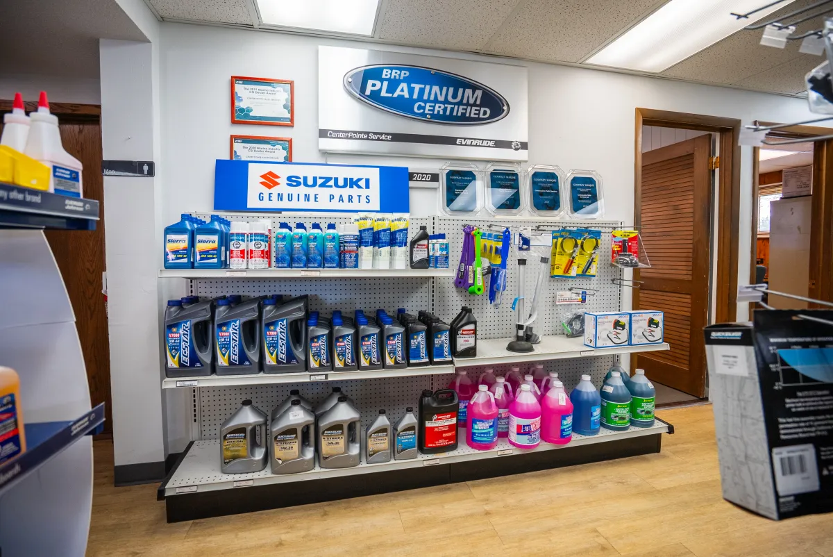 Suzuki genuine parts, oils and marine antifreeze on the CenterPointe parts counter shelves
