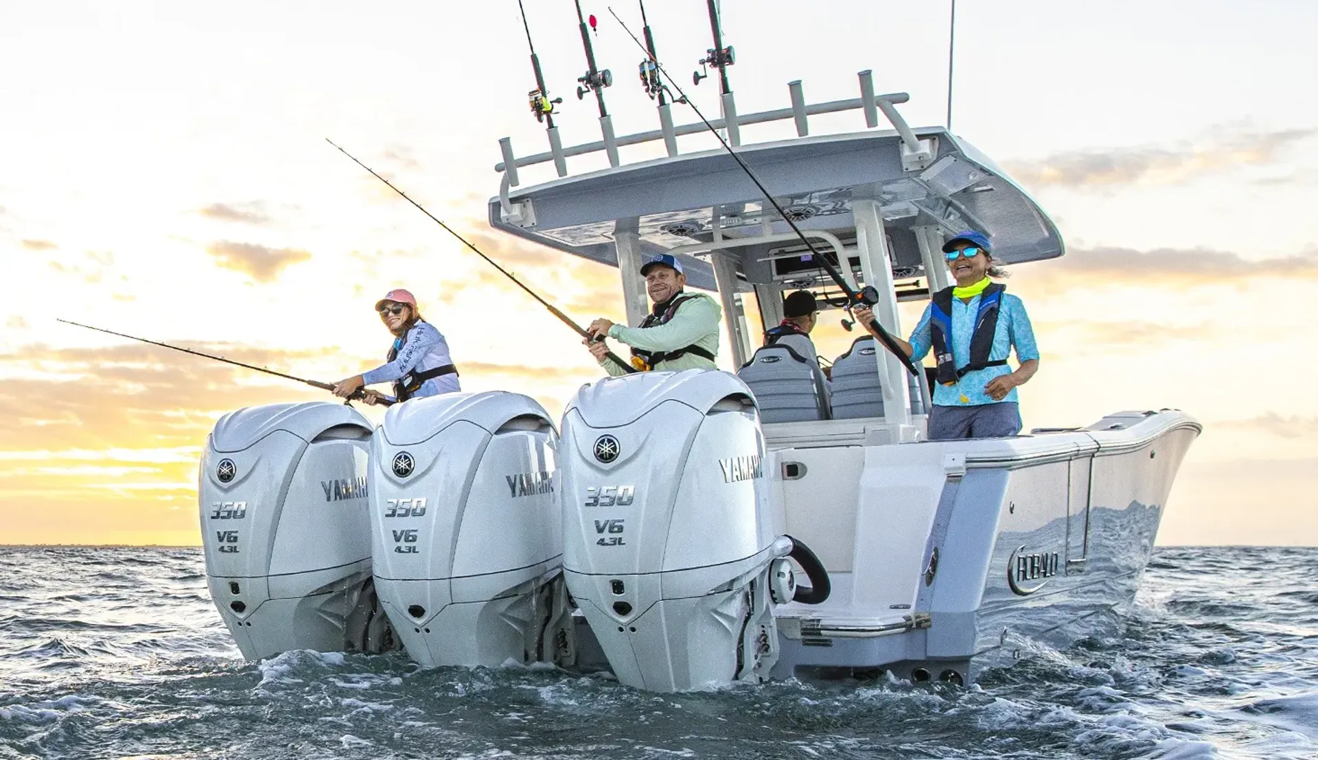 Yamaha outboard engine mounted on boat with water and scenery