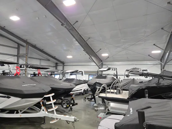 Indoor boat storage facility with multiple boats