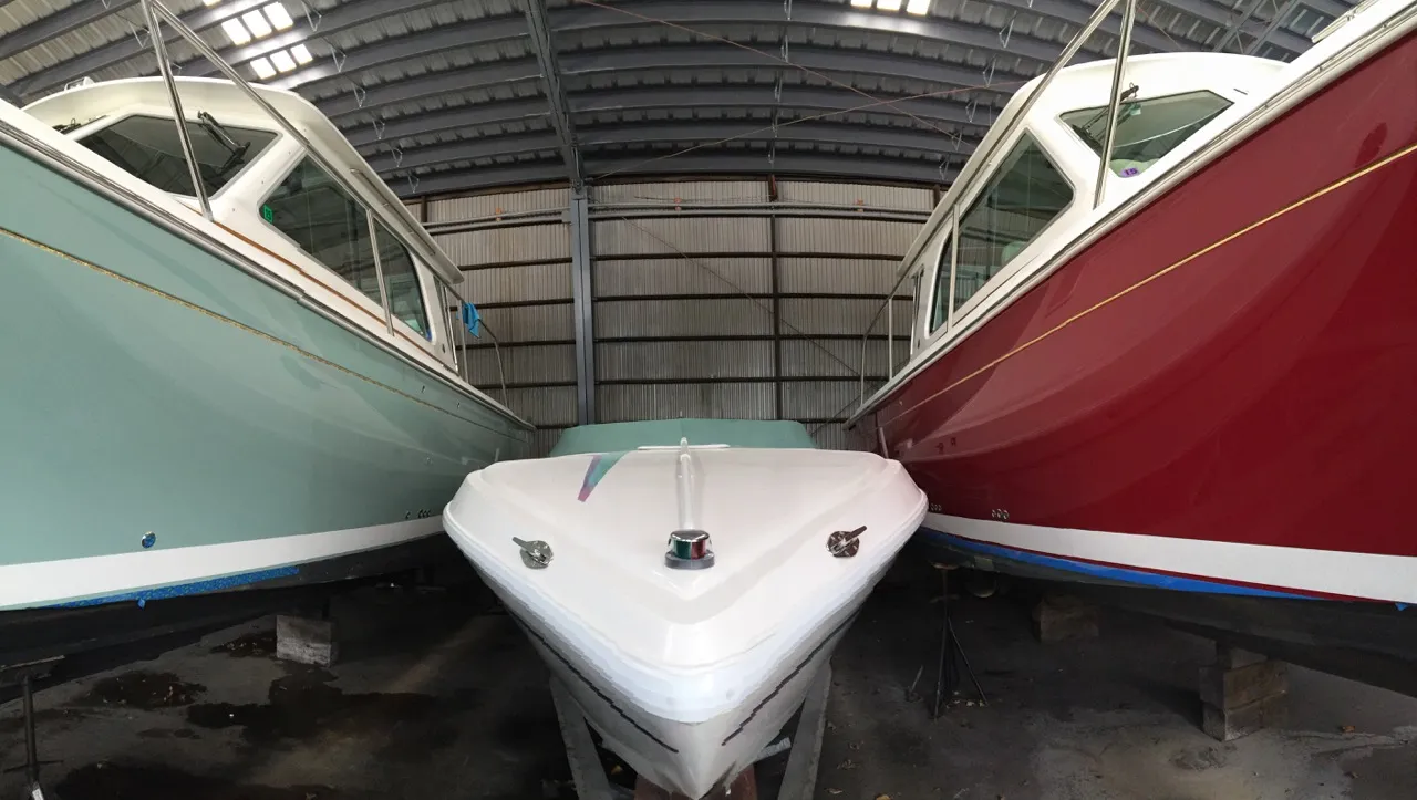 Boats inside the heated indoor winter storage building at Petzold&rsquo;s Marine Center
