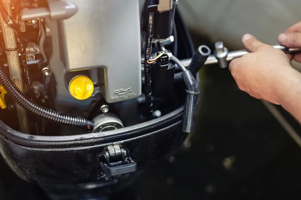 Marine technician preparing a boat for winter