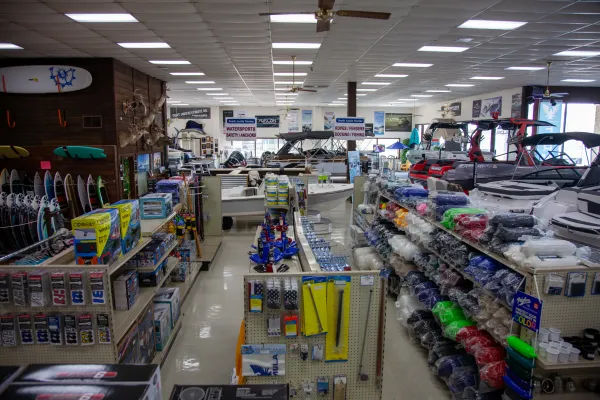 Knowledgeable parts department staff assisting customer with marine accessories selection