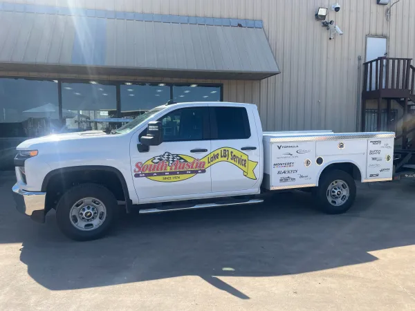 Boat being professionally launched at Lake LBJ by experienced hauling team