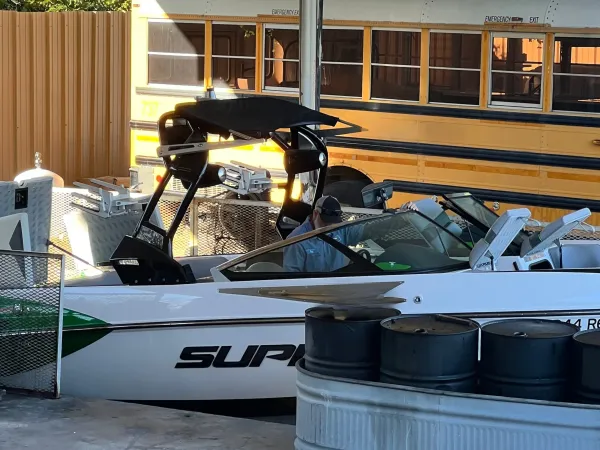 Clean and organized boat service facility with multiple repair stations