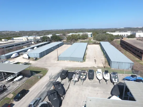 Covered boat storage facility with multiple boats protected under roof at South Austin Marine