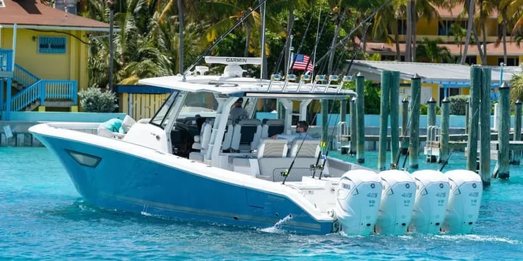 Center console boat docking alongside a slip