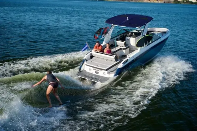 Boat under way with a watersports rider in tow