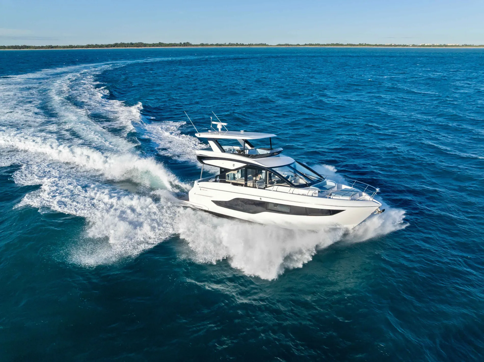 A Cruisers Yachts Fly 50 flybridge yacht cruising the waters off New York
