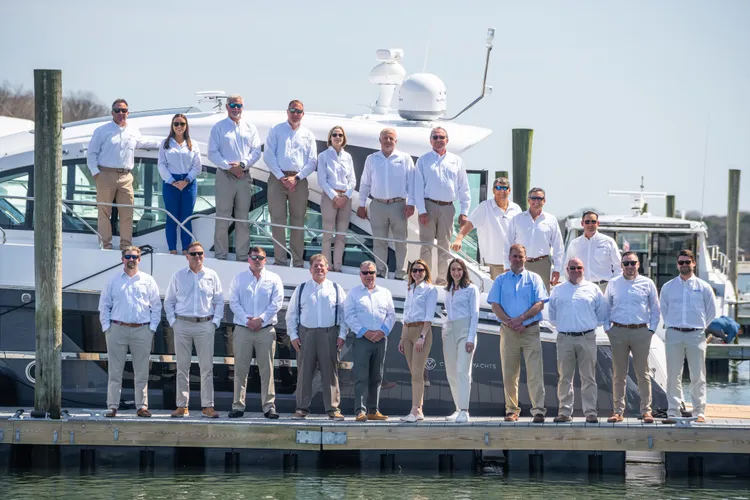 The Strong's Yachts sales team on the dock