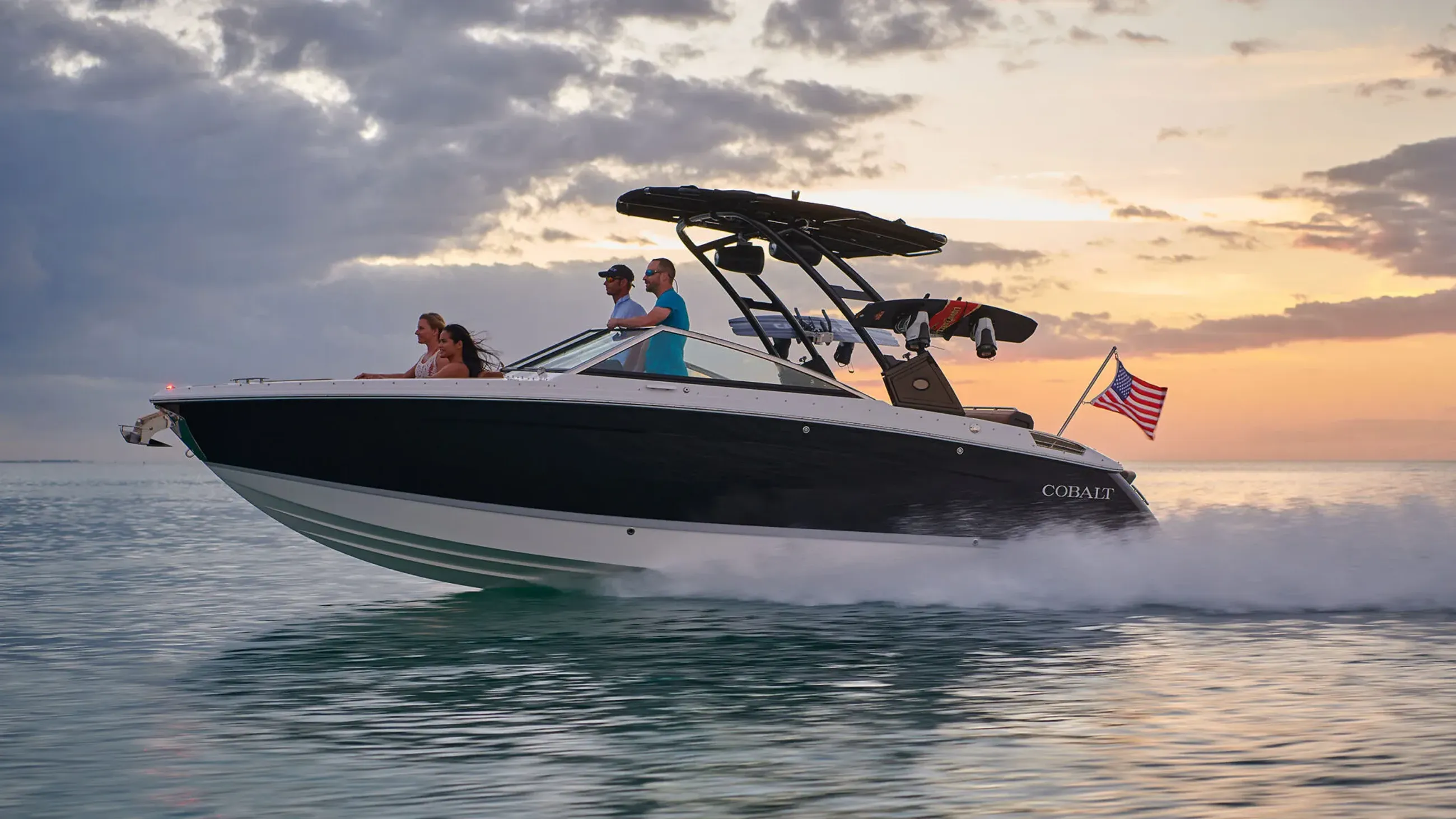 A Strong's Marine boat cruising Long Island waters at sunset