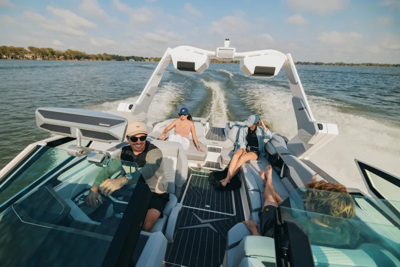 Family relaxing on a MasterCraft on the water